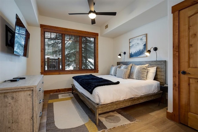 bedroom featuring ceiling fan and light wood-type flooring