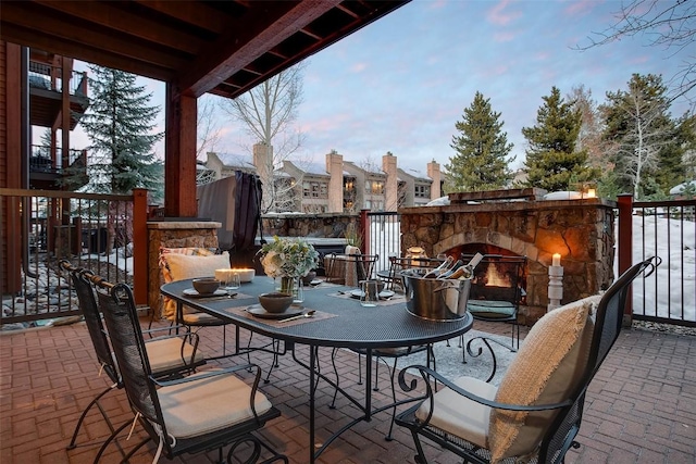 view of patio featuring an outdoor stone fireplace