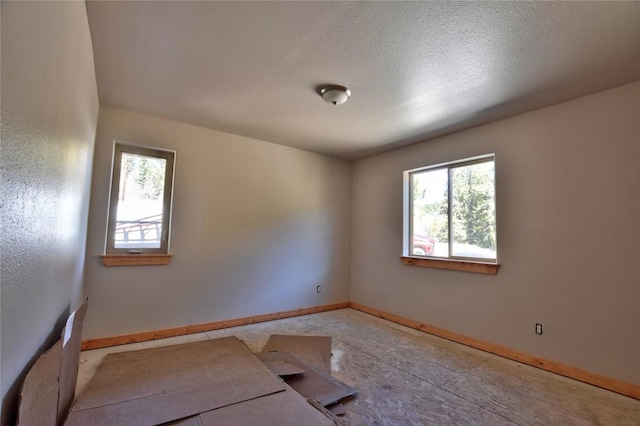 spare room featuring a textured ceiling