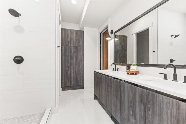 bathroom featuring a shower and vanity