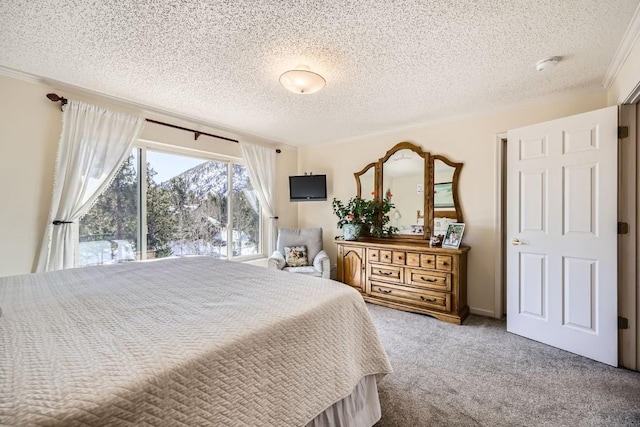 carpeted bedroom with a textured ceiling and crown molding