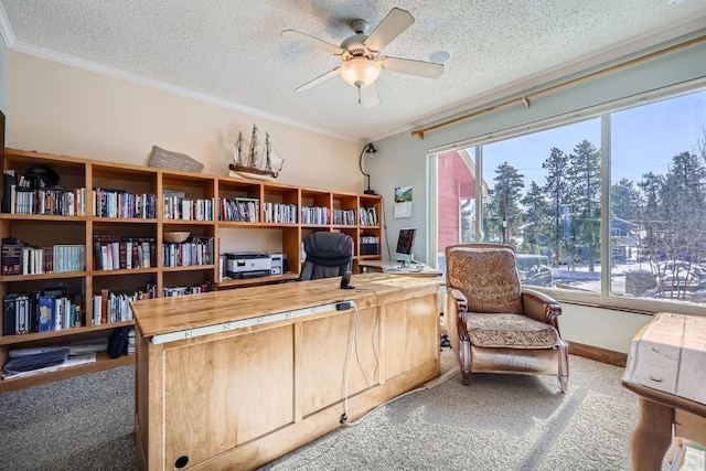 carpeted office with baseboards, a textured ceiling, ceiling fan, and crown molding