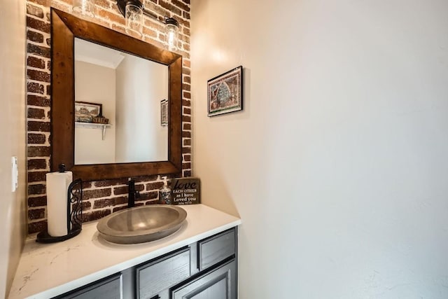 bathroom featuring vanity and ornamental molding