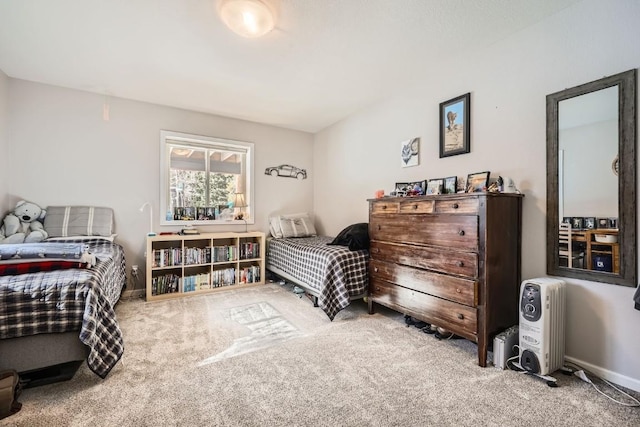 bedroom with carpet flooring and baseboards