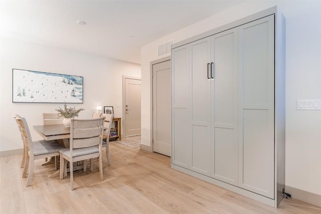 dining area with light wood-type flooring