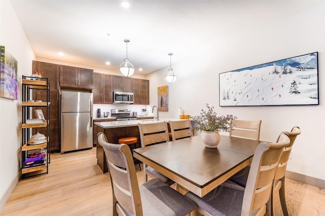 dining room featuring light hardwood / wood-style flooring