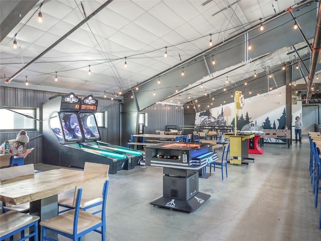 game room with pool table and concrete flooring