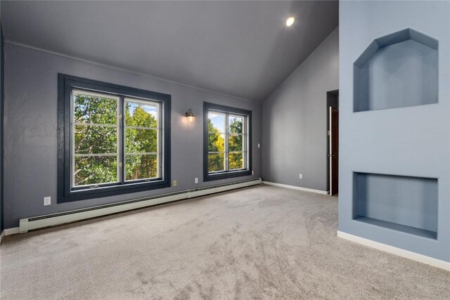 unfurnished living room with vaulted ceiling, light colored carpet, and a baseboard radiator