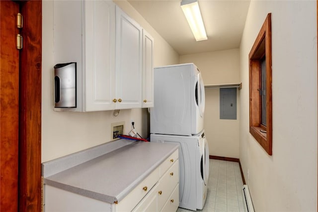 laundry area with cabinets, electric panel, stacked washing maching and dryer, and a baseboard radiator