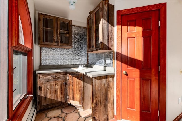 kitchen featuring decorative backsplash and sink