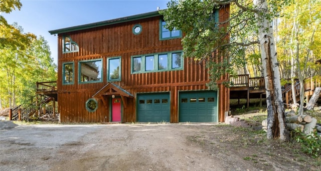 view of front of house featuring a wooden deck and a garage