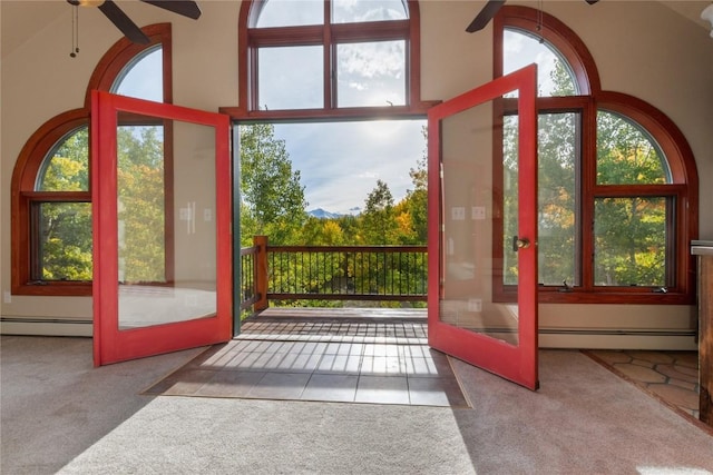 doorway to outside featuring carpet flooring, ceiling fan, french doors, and a baseboard heating unit