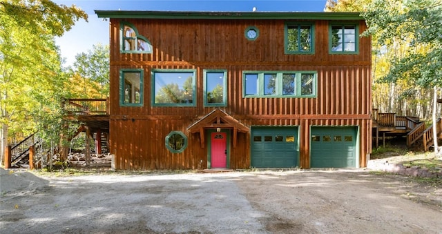 view of front facade featuring a garage and a deck