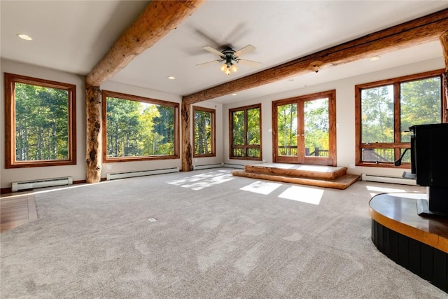 unfurnished sunroom with ceiling fan, beam ceiling, and a baseboard heating unit