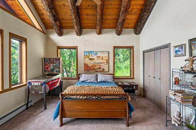 carpeted bedroom featuring vaulted ceiling with beams, a closet, baseboard heating, and wooden ceiling