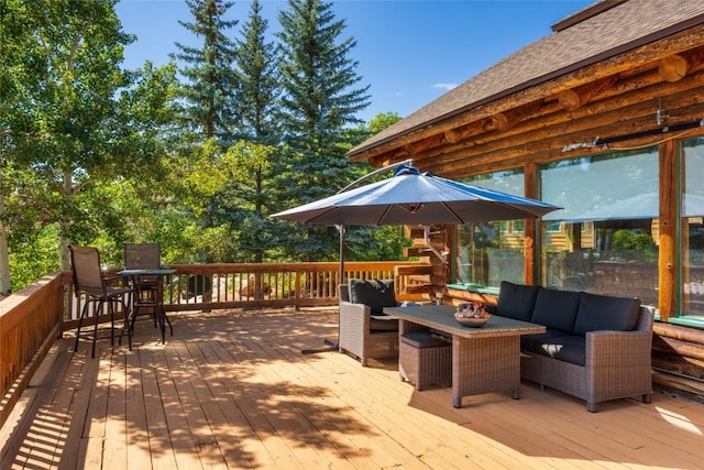 wooden terrace featuring an outdoor living space