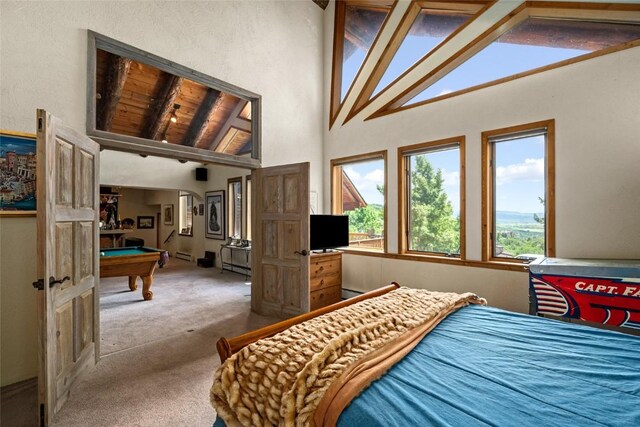 carpeted bedroom with beamed ceiling, high vaulted ceiling, wood ceiling, and pool table