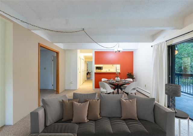 carpeted living room with beam ceiling, a chandelier, and a baseboard heating unit