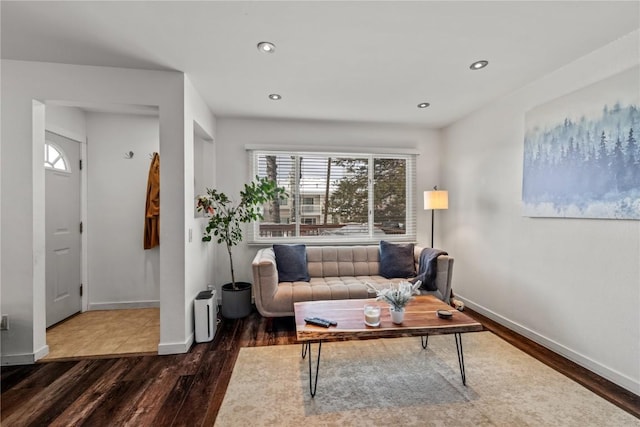 living room with dark hardwood / wood-style floors