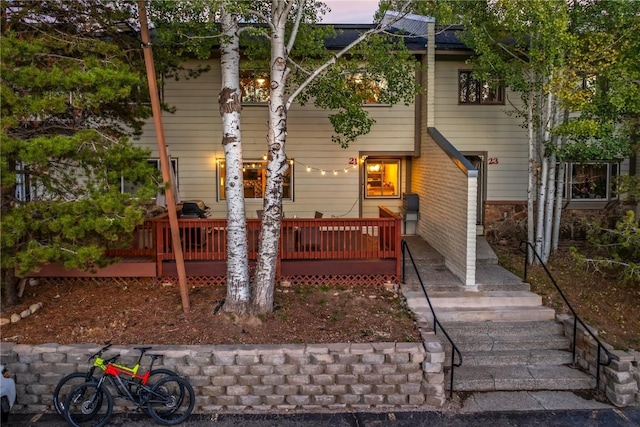 view of front of property with a wooden deck