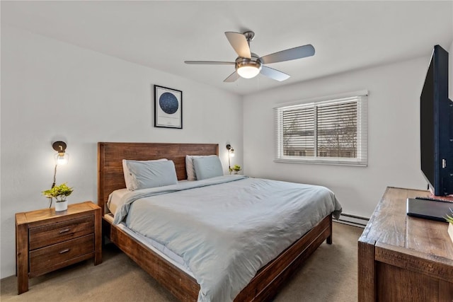 bedroom with a baseboard heating unit, light carpet, and ceiling fan