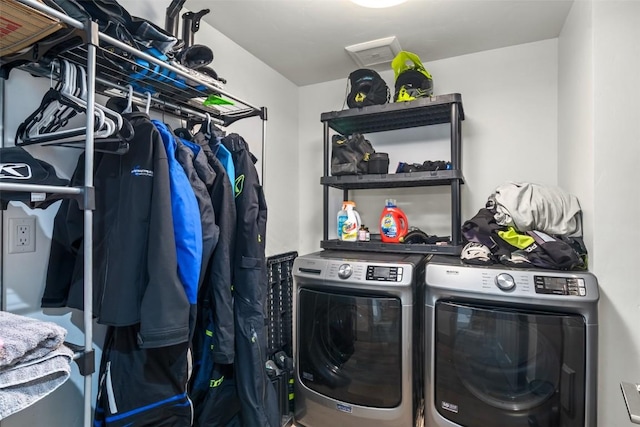 washroom featuring laundry area and washer and clothes dryer