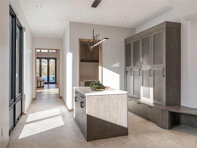 mudroom featuring light tile patterned floors and an inviting chandelier