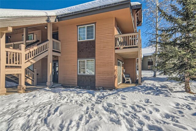 view of snow covered house