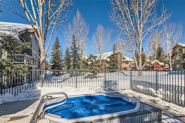 view of snow covered pool