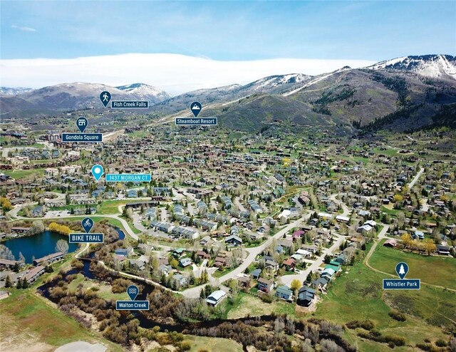 bird's eye view featuring a water and mountain view