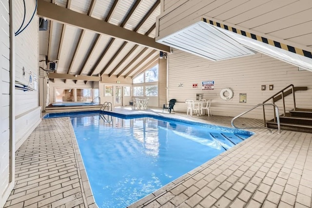 pool with outdoor dining space and a patio