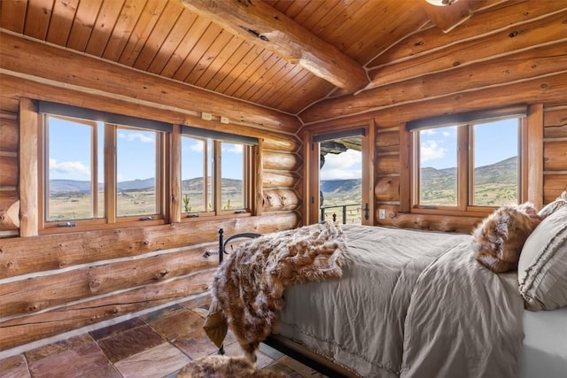 bedroom featuring access to exterior, log walls, lofted ceiling with beams, a mountain view, and wood ceiling