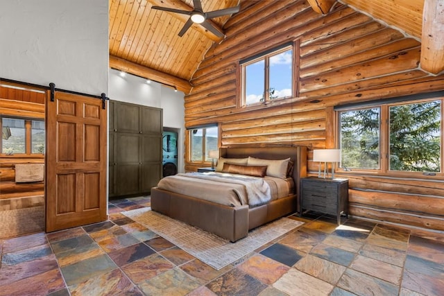 bedroom featuring wood ceiling, ceiling fan, log walls, a barn door, and high vaulted ceiling