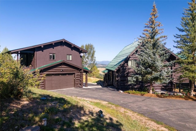 view of side of home with a garage