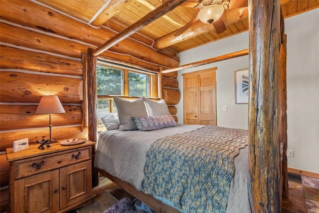 bedroom with rustic walls, ceiling fan, beamed ceiling, and wooden ceiling