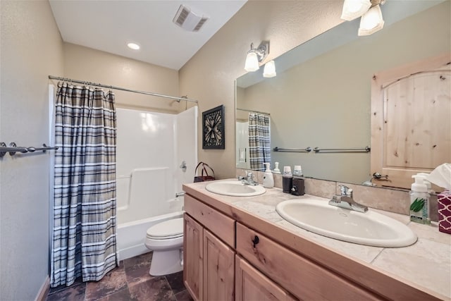 full bathroom featuring vanity, shower / tub combo with curtain, and toilet