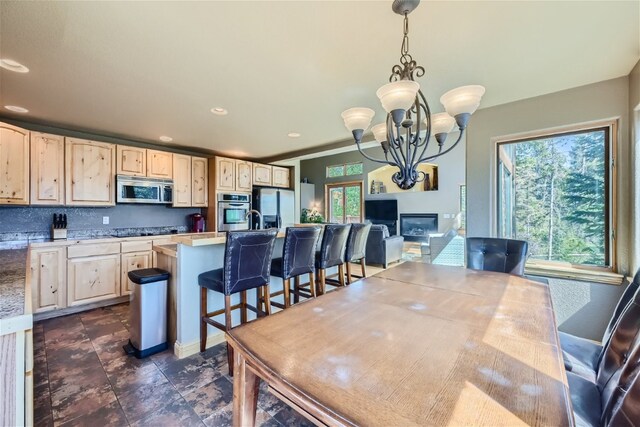 dining space with a chandelier