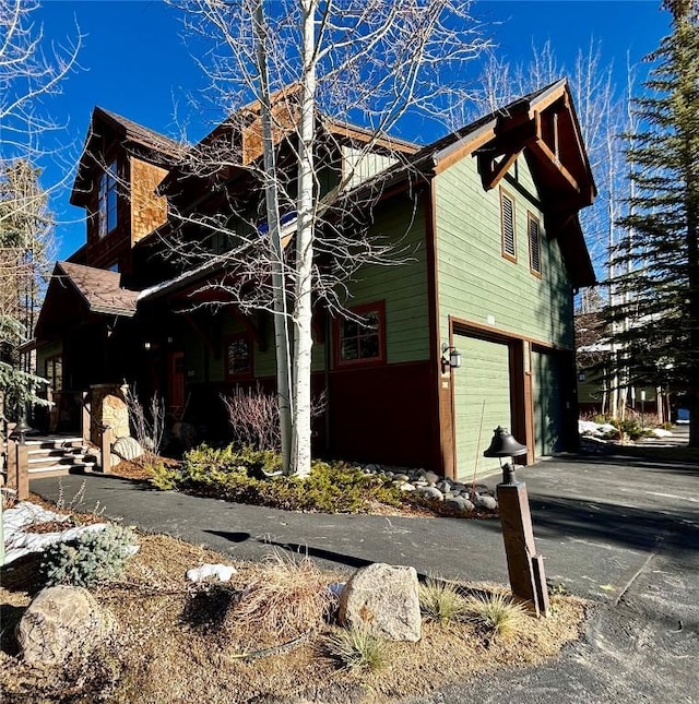 view of property exterior with a garage