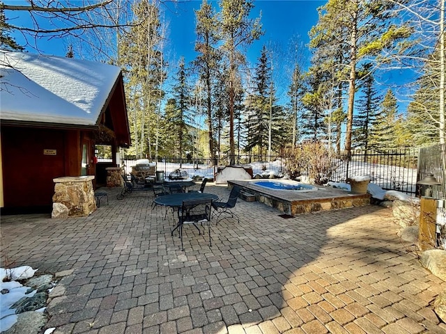 view of patio / terrace featuring a jacuzzi