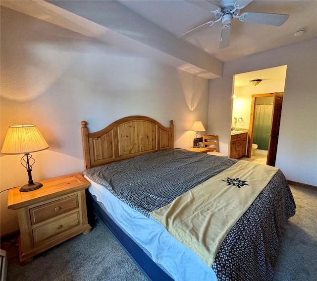 bedroom with carpet, connected bathroom, and ceiling fan