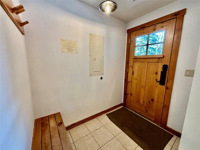 tiled foyer entrance with electric panel