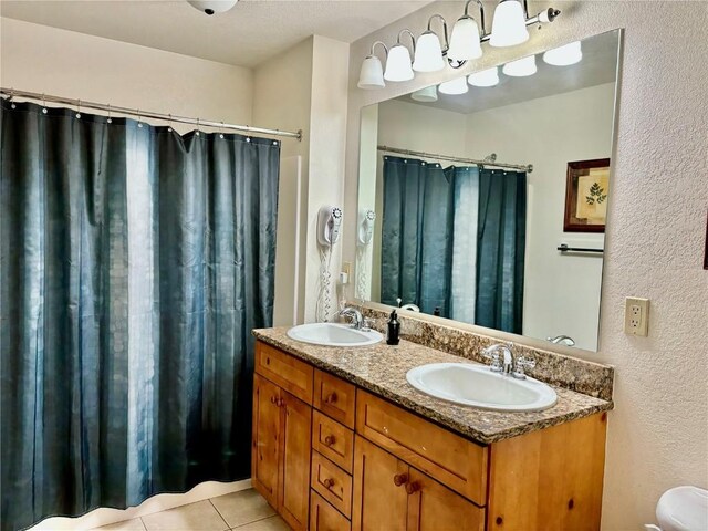 bathroom with tile patterned flooring and vanity