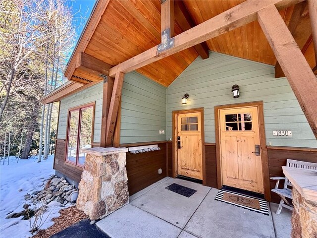 view of snow covered property entrance