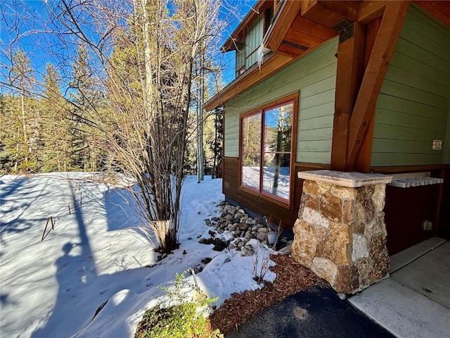 view of snow covered property