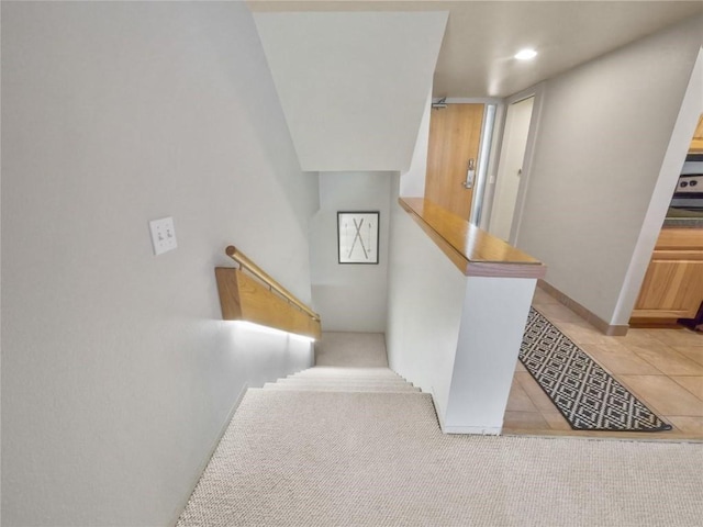 staircase with tile patterned floors