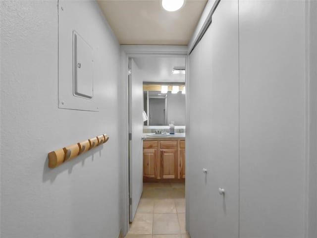 corridor with light tile patterned flooring