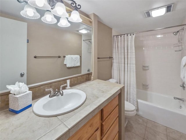 full bathroom with tile patterned flooring, vanity, shower / bath combo with shower curtain, and toilet