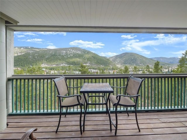 wooden terrace featuring a mountain view