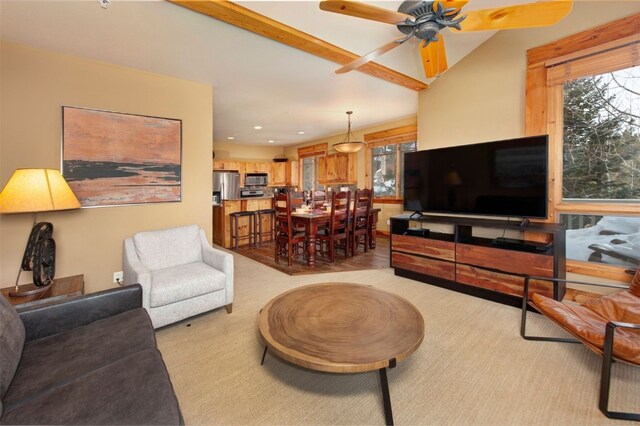 living room featuring lofted ceiling, ceiling fan, and recessed lighting