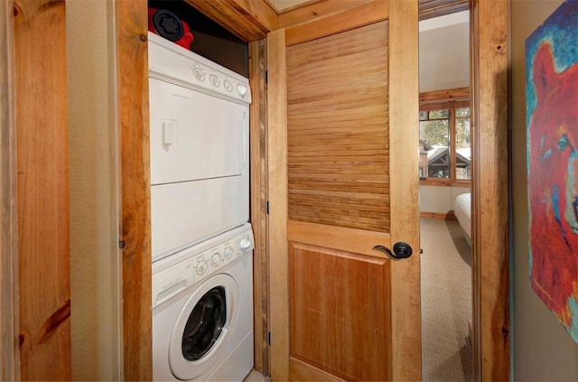 washroom with stacked washer and clothes dryer